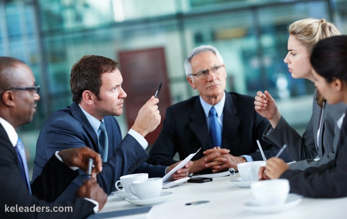 Group of contract management professionals in a London training session discussing case studies
